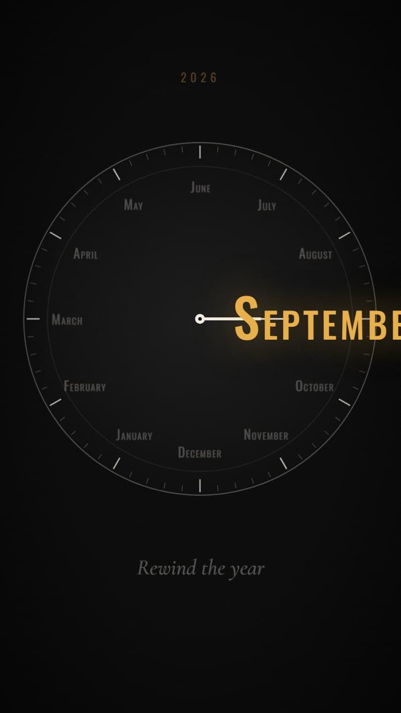 The word September in gold letters zoomed in so large it runs off the edges of a black clock face